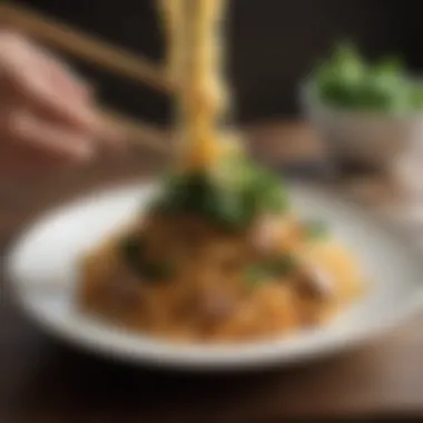 A plate of noodles served with a balanced portion of protein and greens.