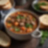 A bowl of Cajun beef stew garnished with fresh herbs and served with crusty bread