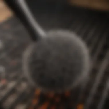 A close-up of a grill brush in action