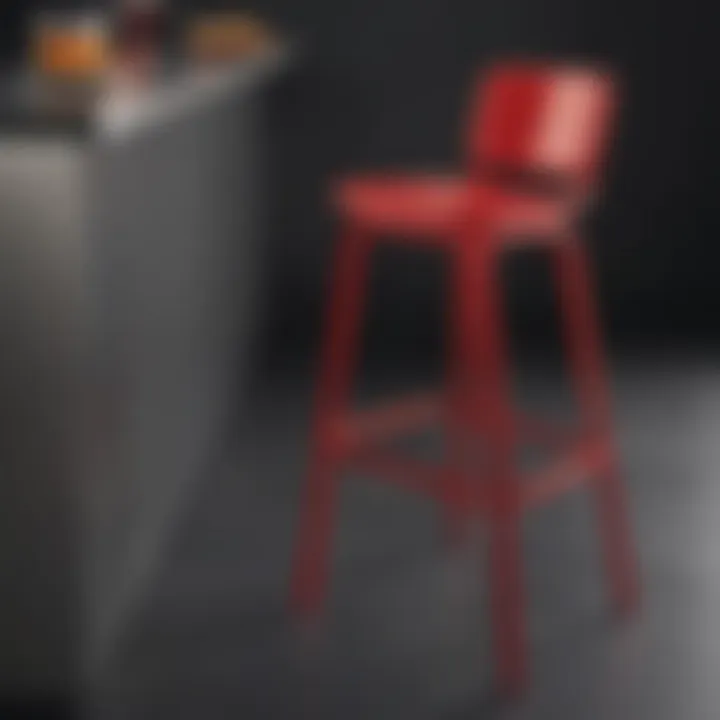 Close-up of a stylish red bar stool made from sleek metal and comfortable cushioning.