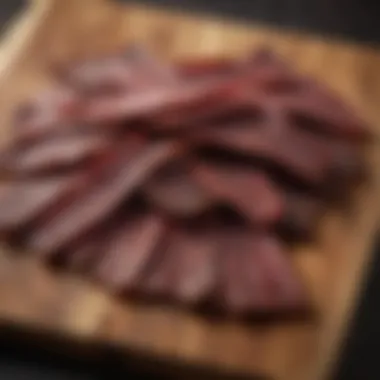 Dehydrated beef jerky showcased on a rustic wooden board.