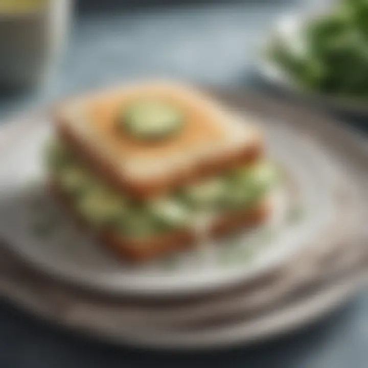 A close-up view of a classic cucumber sandwich on a delicate plate.