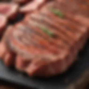 A close-up of seasoned meat ready for grilling