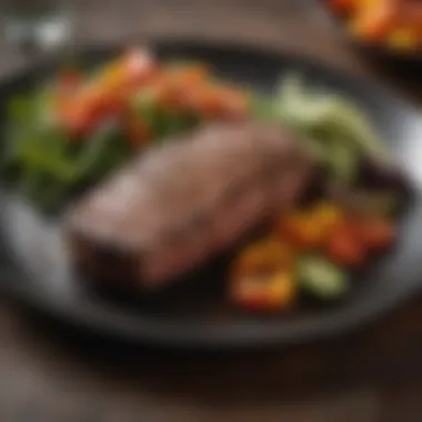 A beautifully plated dish featuring blackened steak alongside vibrant vegetables.