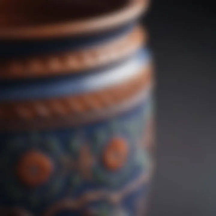 A close-up view of the smooth surface and intricate detailing of a Dansk enamelware pot.