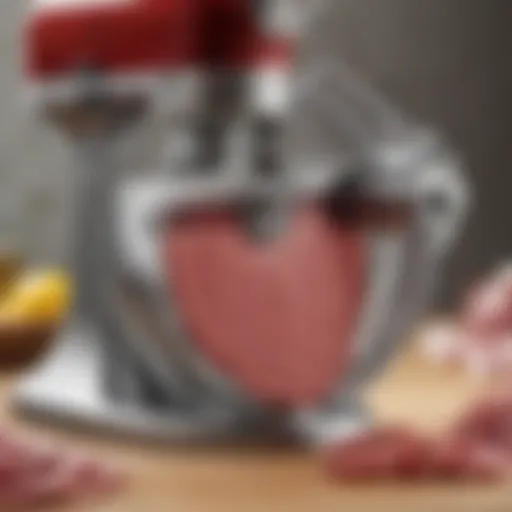 Close-up of the KitchenAid meat slicer attachment showcasing its sharp blades and sturdy design.