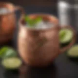 A beautifully garnished Mezcal Mule in a copper mug with lime and mint leaves