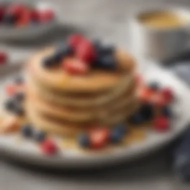 Delicious almond flour pancakes served with fresh berries and syrup.