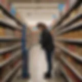 A shopper examining clearance tags in a Walmart aisle
