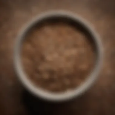 Texture of Ground Seeds After Grinding Close-up of ground seeds in a bowl, showcasing texture