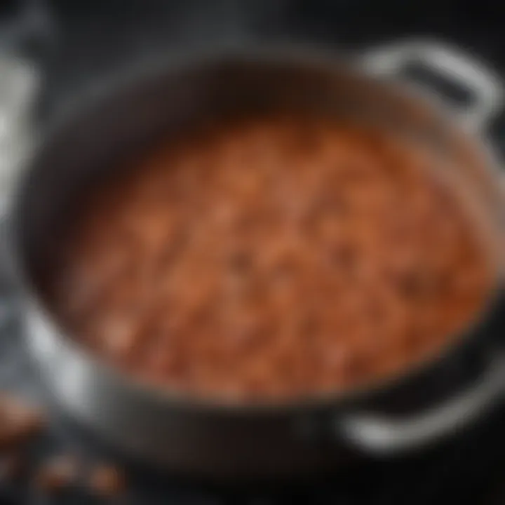 A pot simmering with baked beans, showcasing the bubbling texture