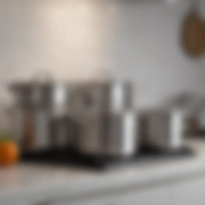 Pristine stainless steel pots arranged aesthetically on a kitchen shelf