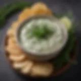 A rich and creamy bowl of keto dill dip garnished with fresh dill