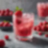 Colorful keto pink drink in a glass with ice and garnished with fresh berries