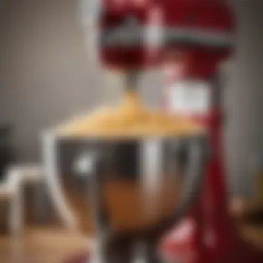 Close-up of a specialized KitchenAid attachment in action, showcasing its utility.