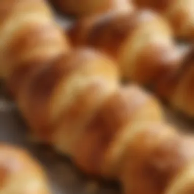 Close-up of the buttery layers of a croissant glistening in the light