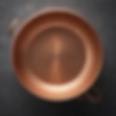 Close-up of Mauviel copper saute pan showcasing its polished surface