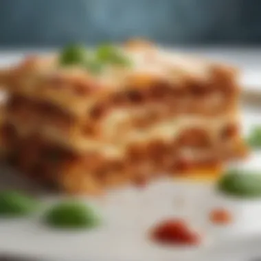 A beautifully plated portion of lasagna garnished with fresh basil