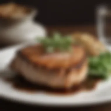 A Delectable Pork Chop Presentation Succulent pork chop garnished with herbs