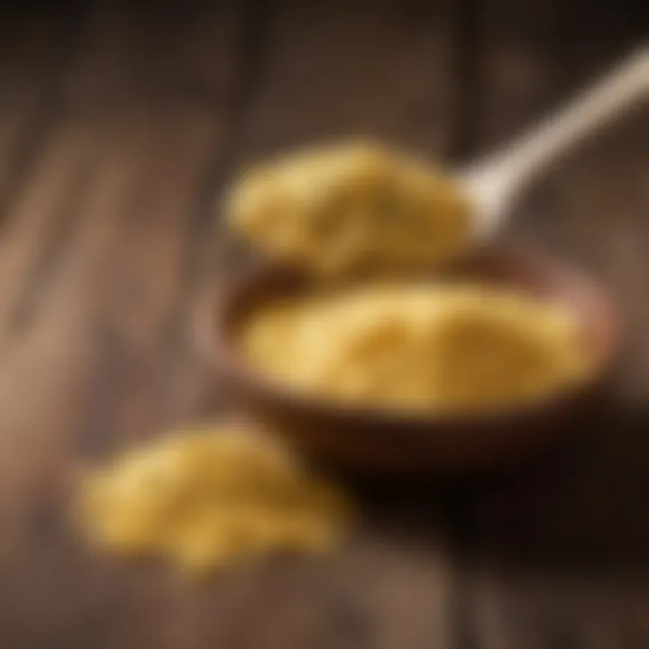 A spoonful of nutritional yeast on a rustic wooden table