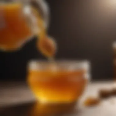 A close-up of honey pouring into a jar