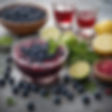 An array of fresh ingredients used in a blueberry margarita including blueberries, limes, and tequila