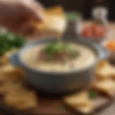 A rich, creamy queso dip with a sprinkle of herbs on top.