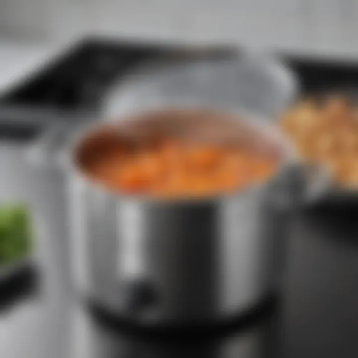 Compact stock pot with integrated strainer, designed for efficient space-saving storage