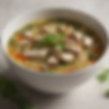 Close-up of fresh herbs adding aroma to chicken noodle soup