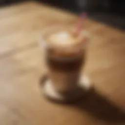 A stylish coffee cup with a lid and straw positioned on a wooden table