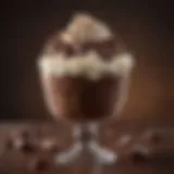 A decadent chocolate frosty topped with whipped cream and chocolate shavings