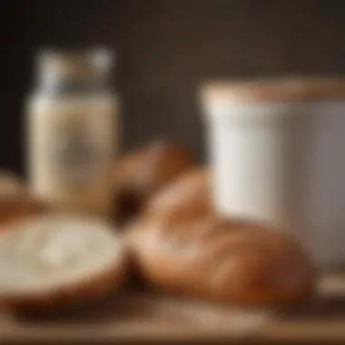 A well-maintained sourdough starter next to a loaf of bread