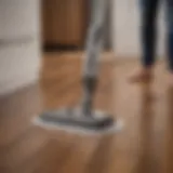 A sleek vacuum-mop hybrid in action on hardwood floors, showcasing its dual capabilities.