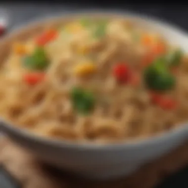 A close-up of a bowl of whole grain noodles with vegetables.